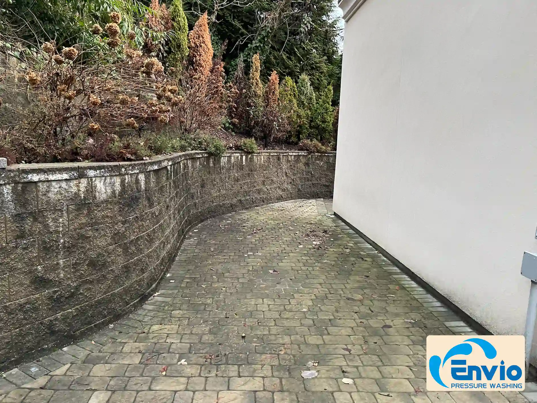 Brown brick driveway and retaining wall